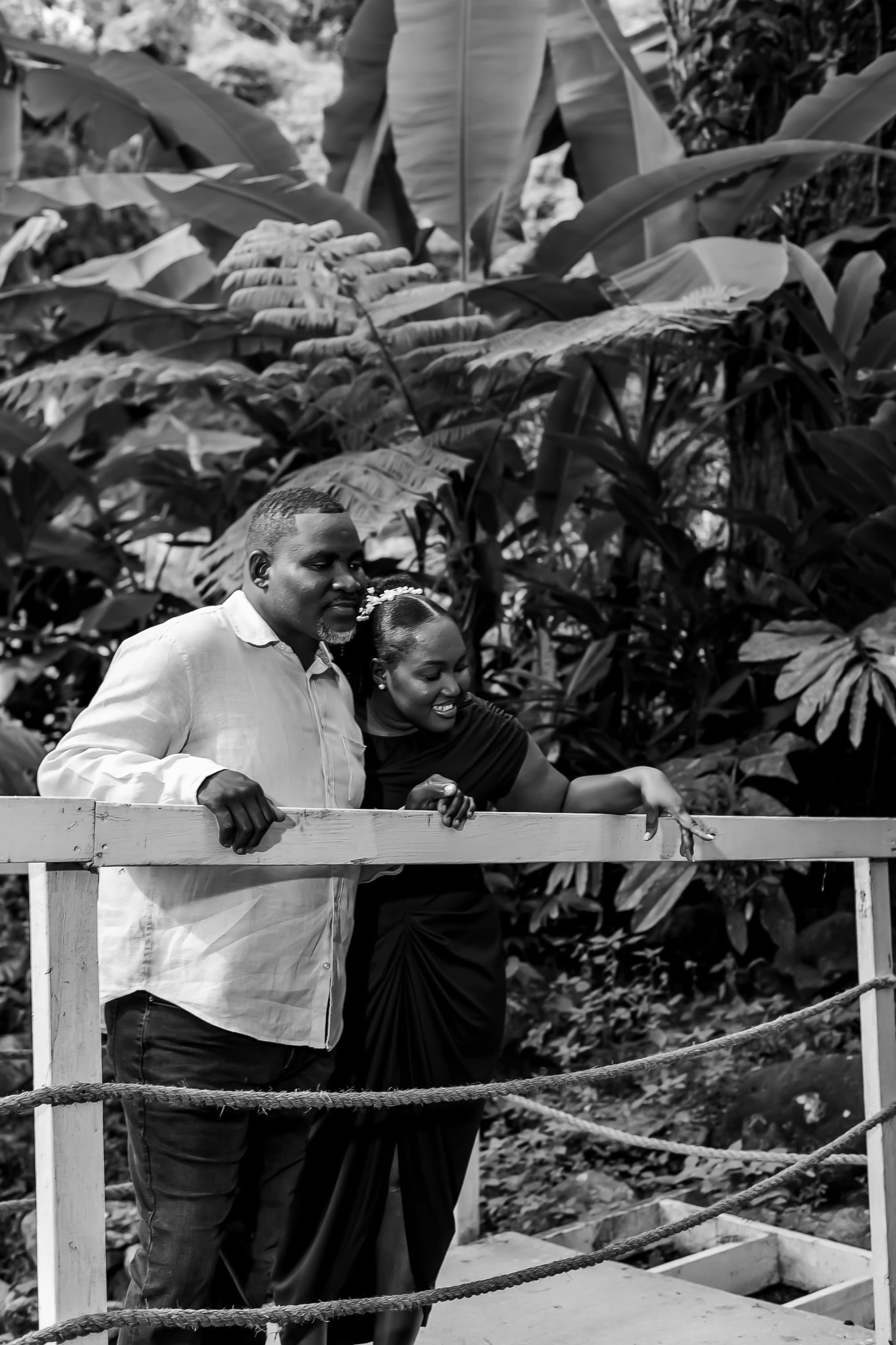 Kerry-Ann and Renado smiling together at the railing