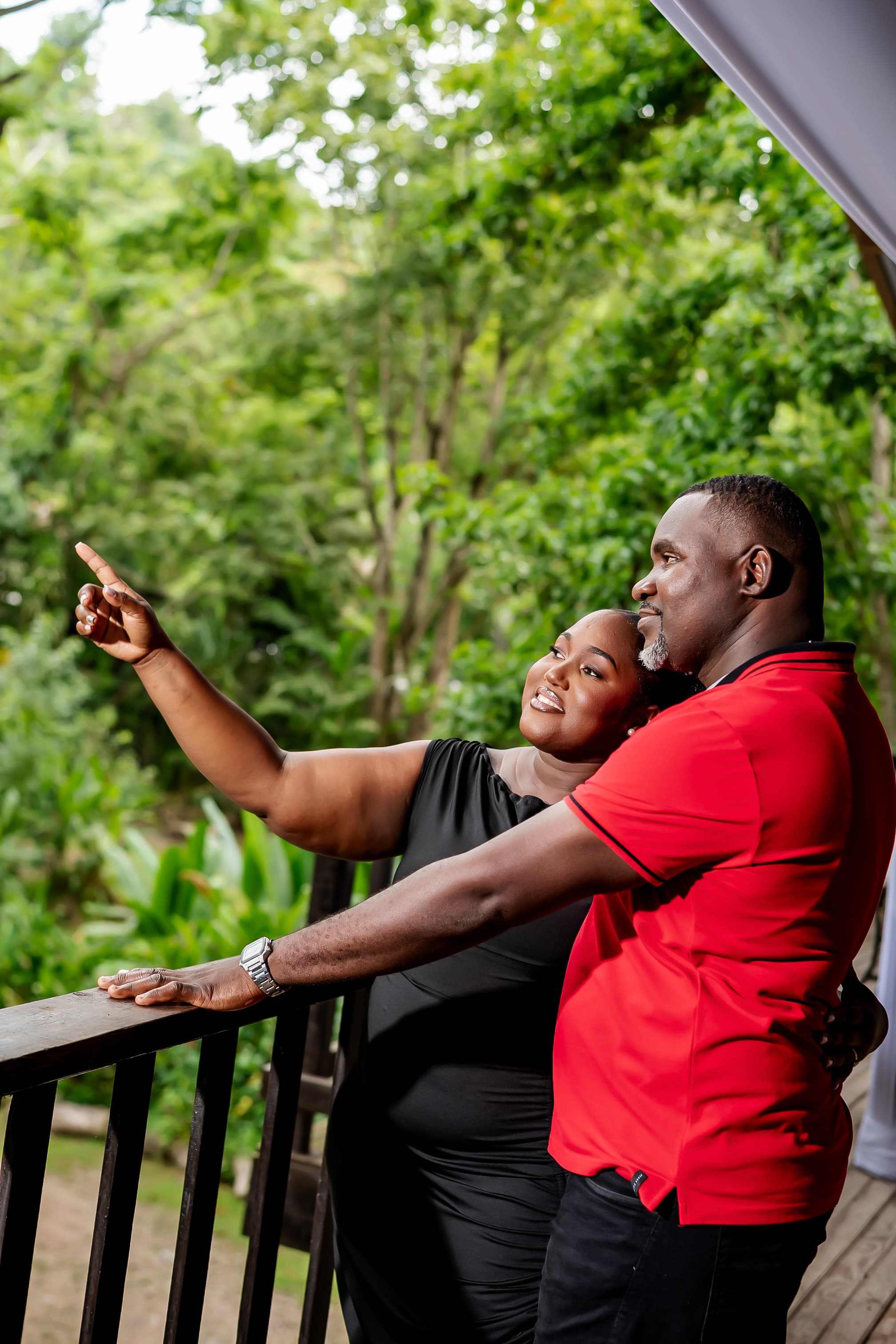 Kerry-Ann and Renado framed through tropical leaves