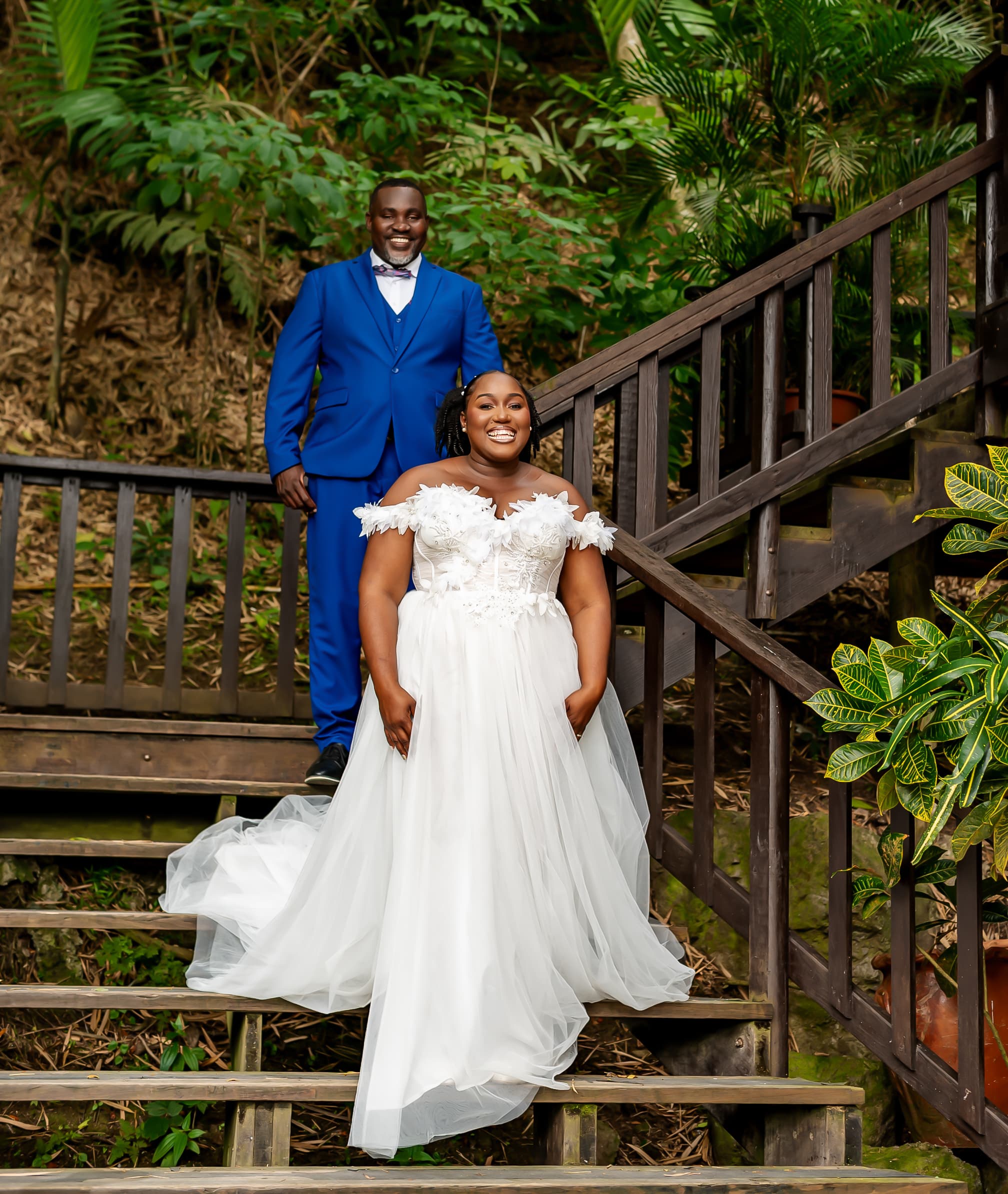 Kerry-Ann and Renado on the steps at Holywell Estate